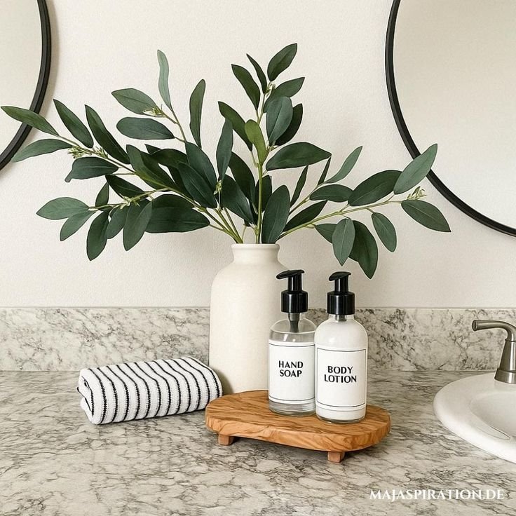 Neatly styled rolled hand towels on a bathroom sink