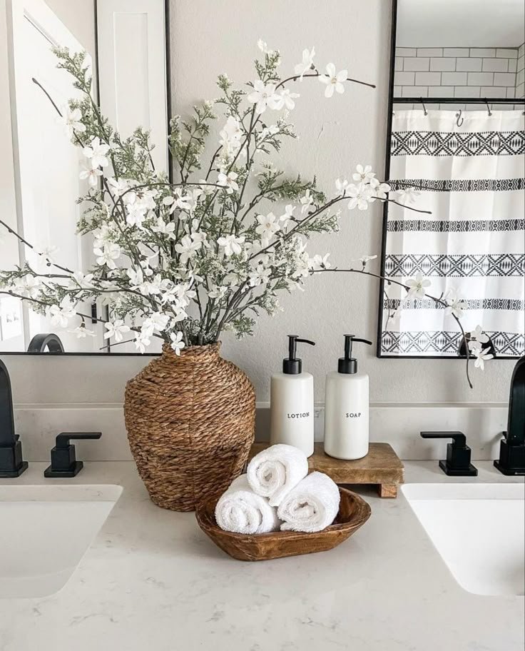 Subtle candle or diffuser styled as a scent element near a sink