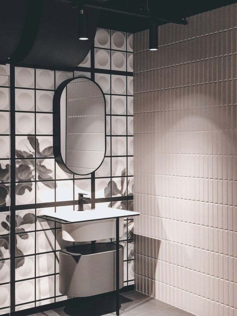 Sculptural wall decor adding texture and dimension to a bathroom