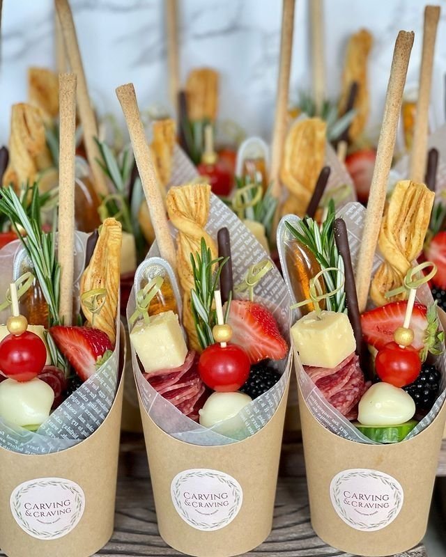 Italian-inspired charcuterie cup with prosciutto, mozzarella balls, cherry tomatoes and olives