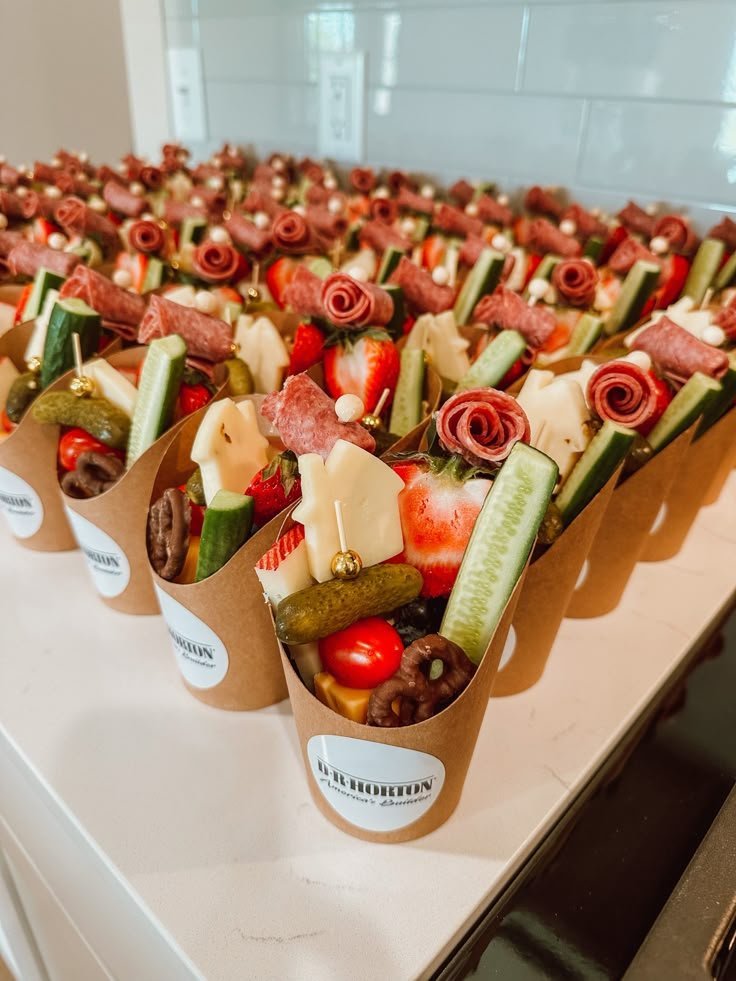 Mediterranean charcuterie cup with salty cheeses, crisp vegetables and olives