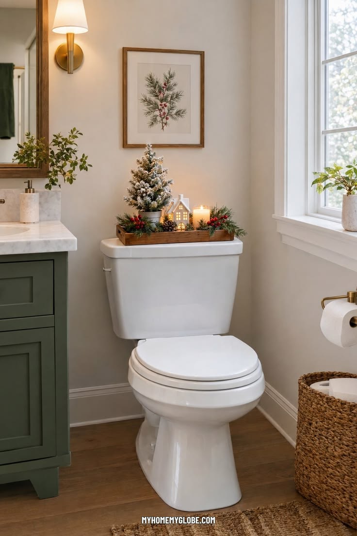 Styled wooden toilet tank tray with a small Christmas tree and candle