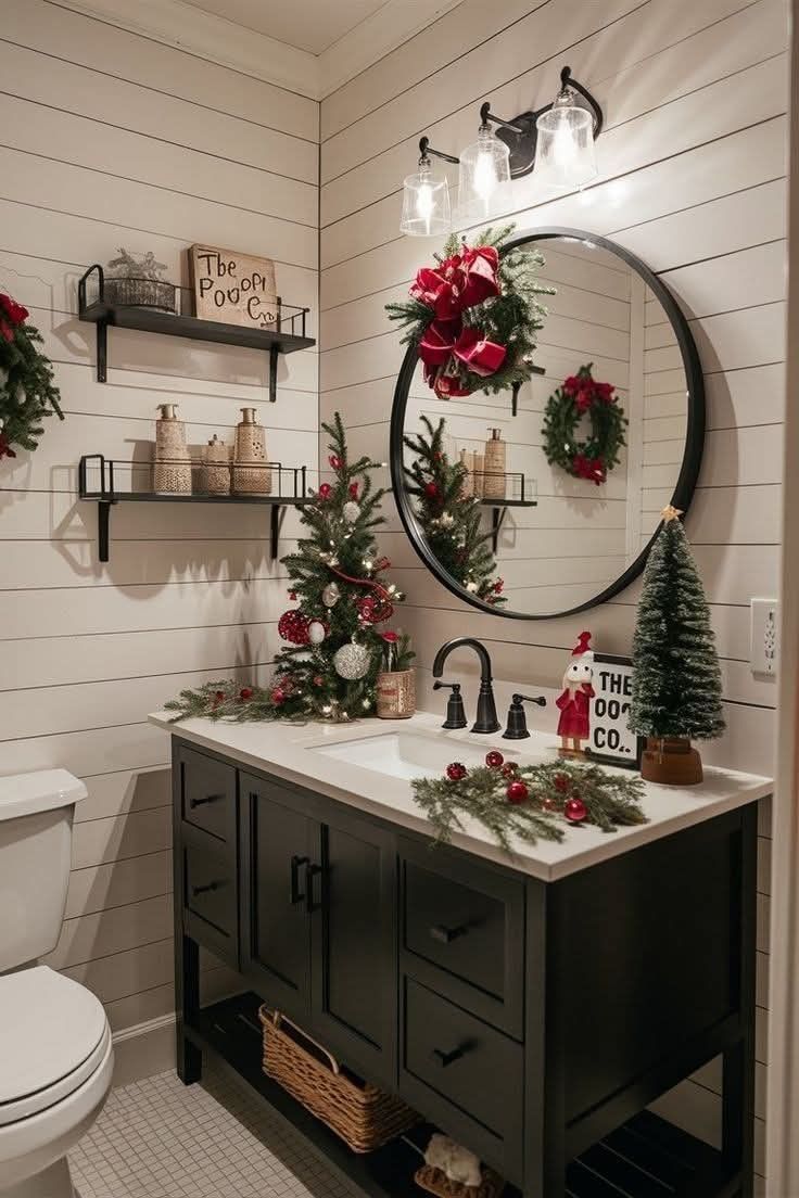 Shiplap bathroom vanity with a round black mirror and mini Christmas trees