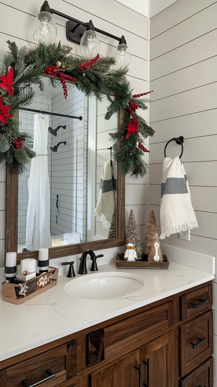 Garland and ornament-topped bathroom mirror with tiered bottle brush trees nearby