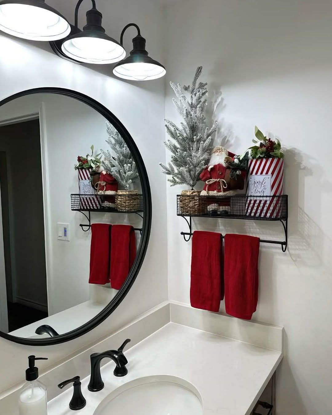 Floating bathroom shelf with a vintage Santa figurine and folded red towels