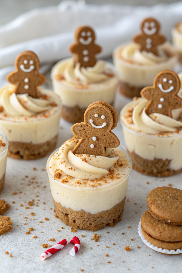 No-bake gingerbread cheesecake cups topped with a mini gingerbread man cookie