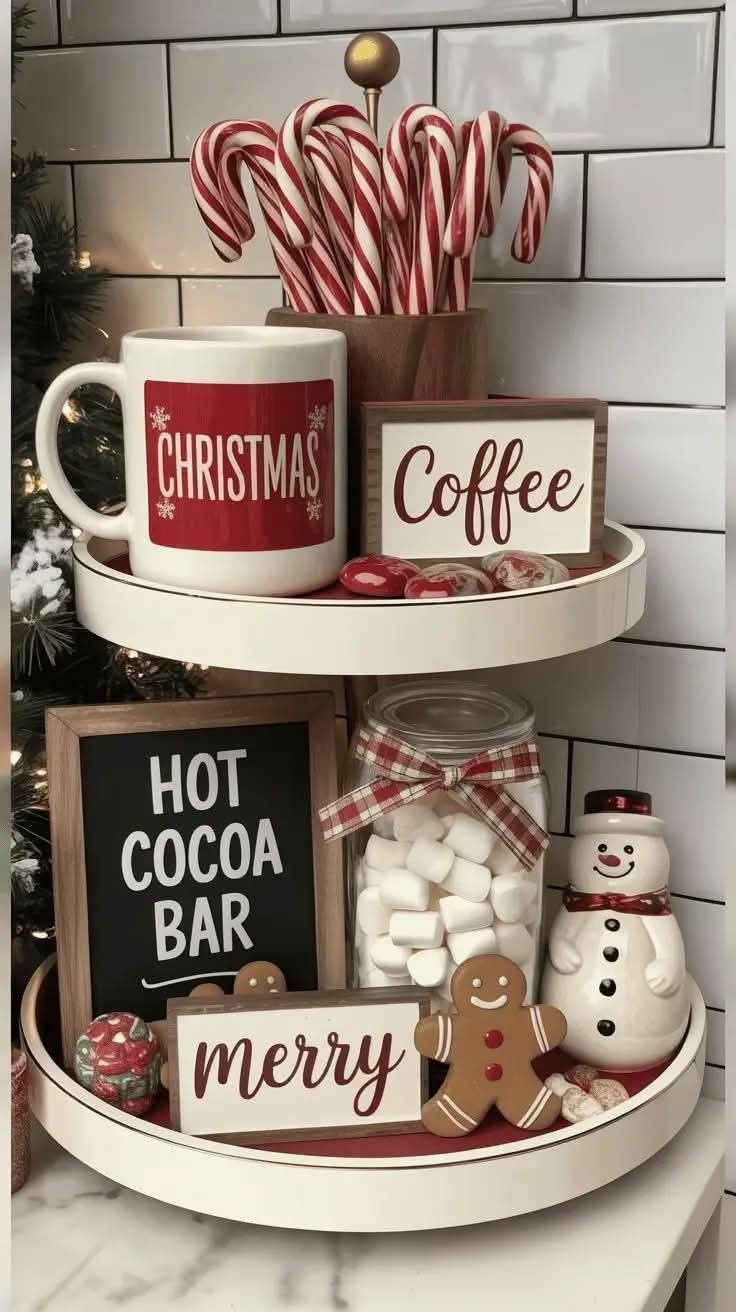 A small tiered tray styled as a hot cocoa bar with a mug and coffee sign