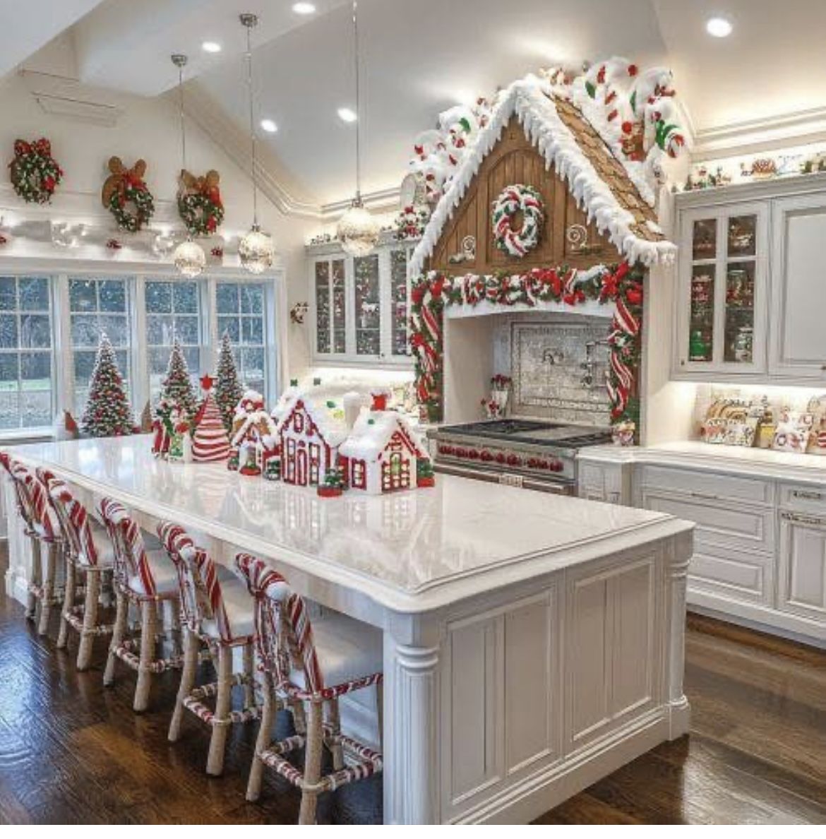 A full gingerbread house display built around a kitchen range hood