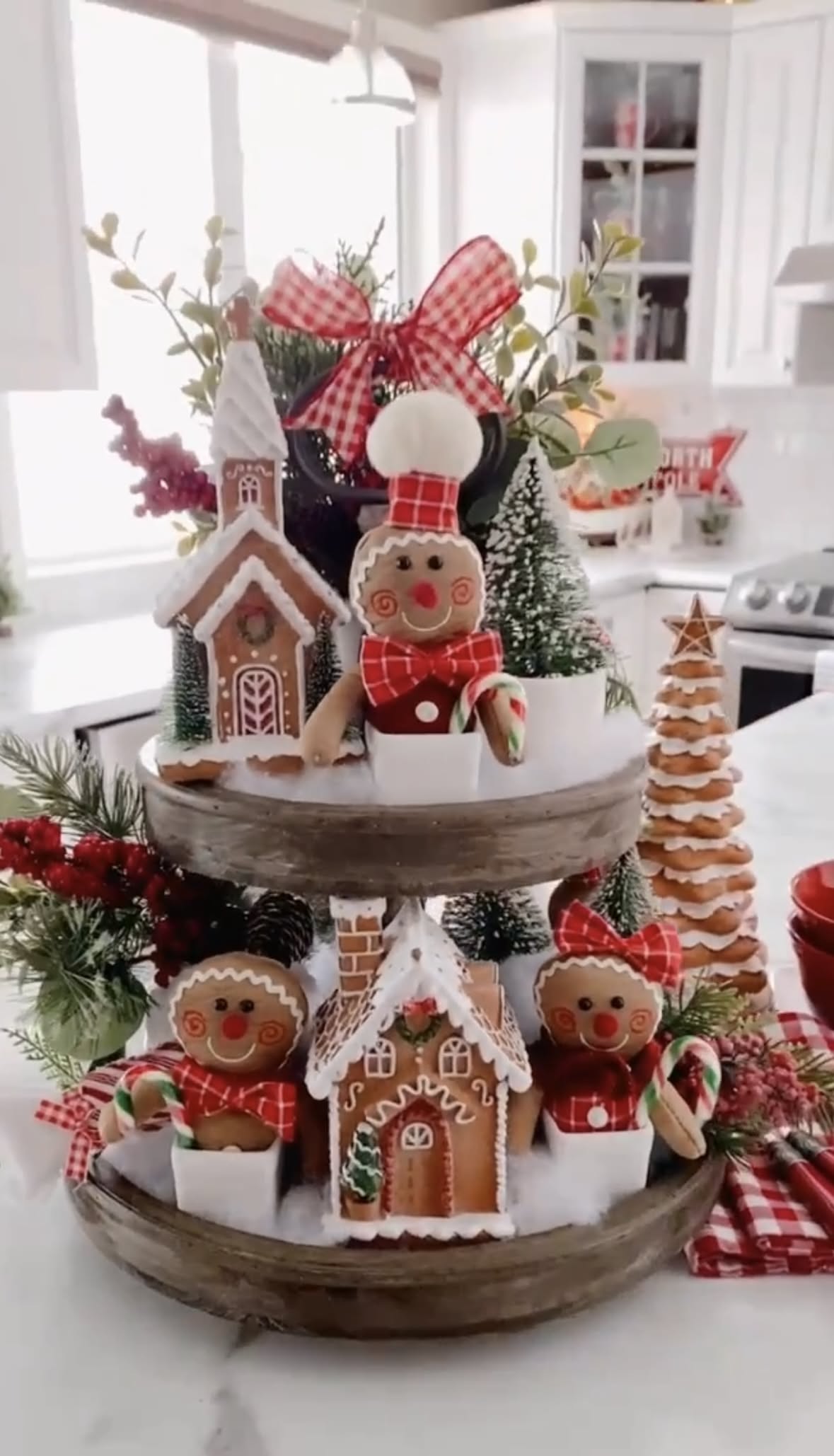 Three-tier wood tray with a Tidings of Comfort and Joy sign and gingerbread figures