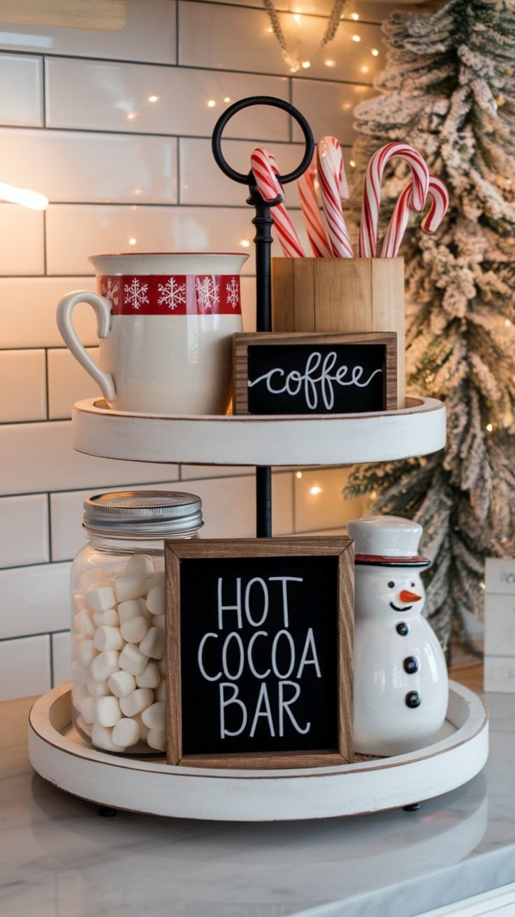 Tiered tray with a Hot Cocoa Bar sign, snowman mug, and marshmallow jar