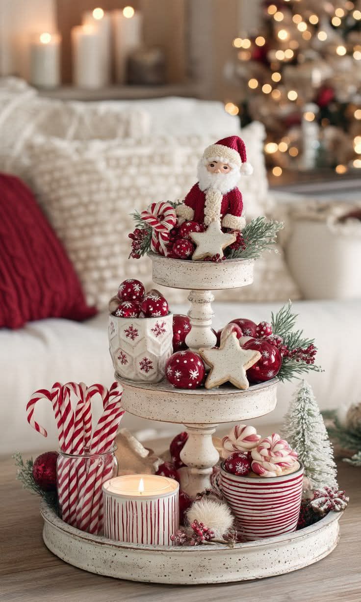 Three-tier white tray with a knit Santa figurine, star cookie, and candy canes