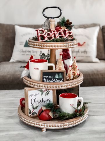 Tiered tray with a red Better sign, mugs, and a Winter Wonderland sign