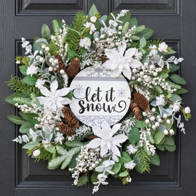 White wreath with poinsettias and a Let It Snow sign