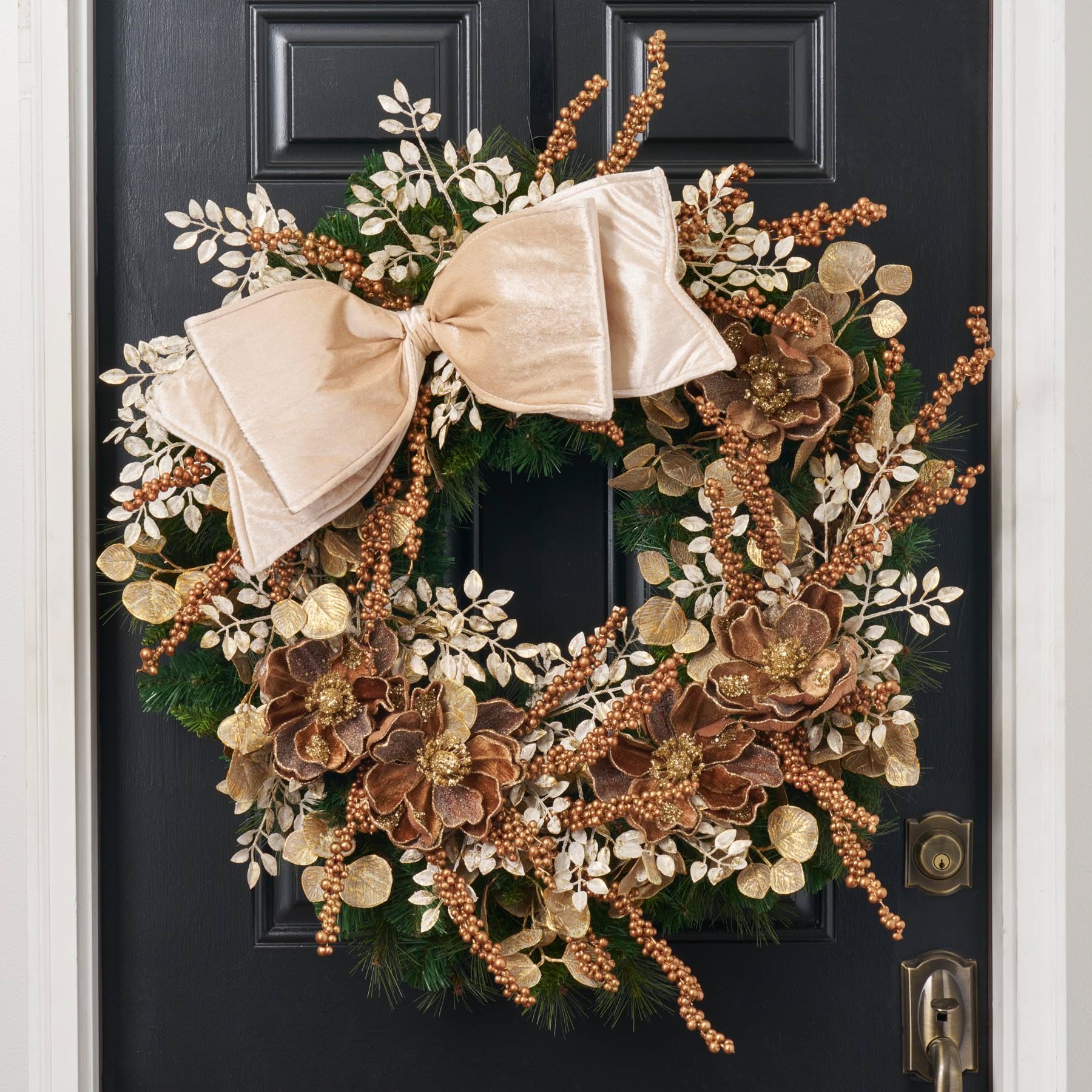Copper and gold magnolia wreath with metallic berry sprays