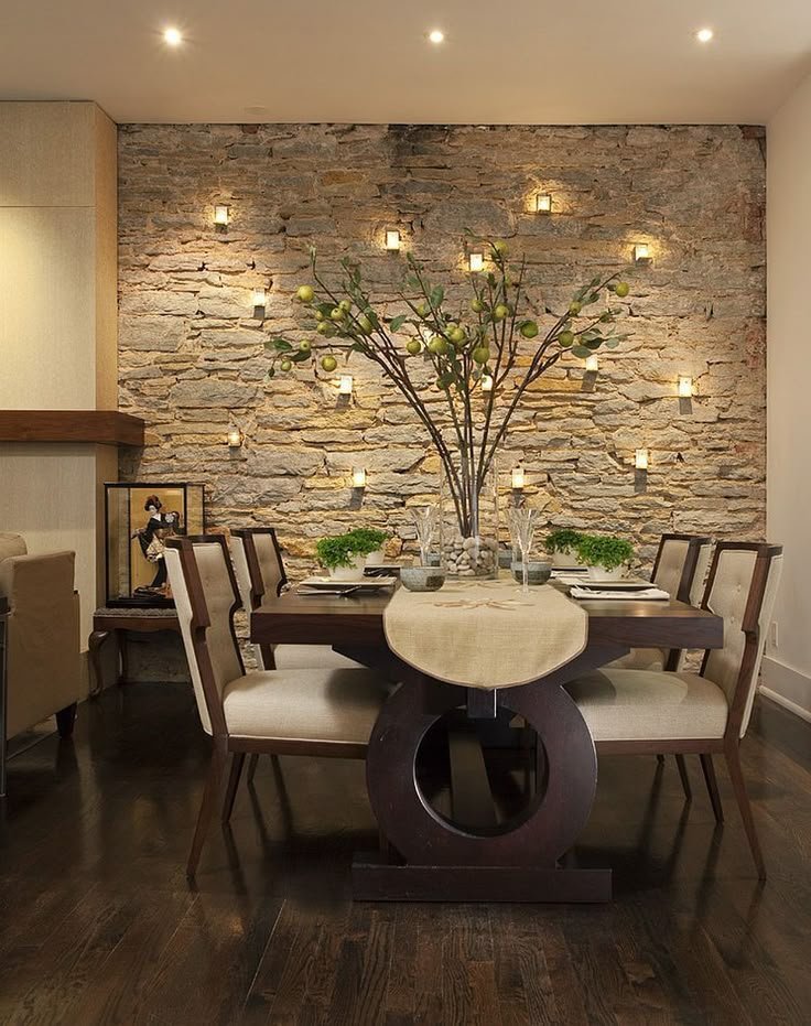 Dining room featuring a textured stone accent wall