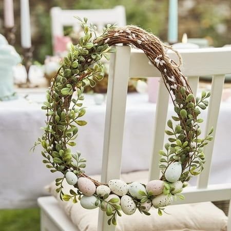Elegant neutral Easter wreath with ivory florals and cream speckled eggs