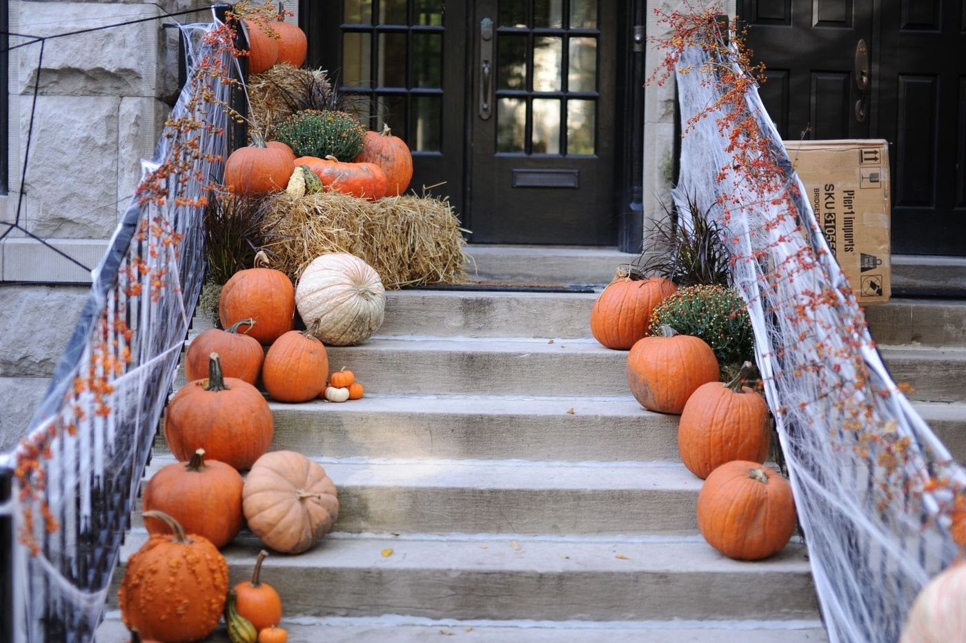 Beautifully styled fall porch with warm seasonal decor