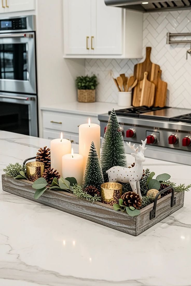 Minimalist trio of candles in varying heights styled as a kitchen island centerpiece