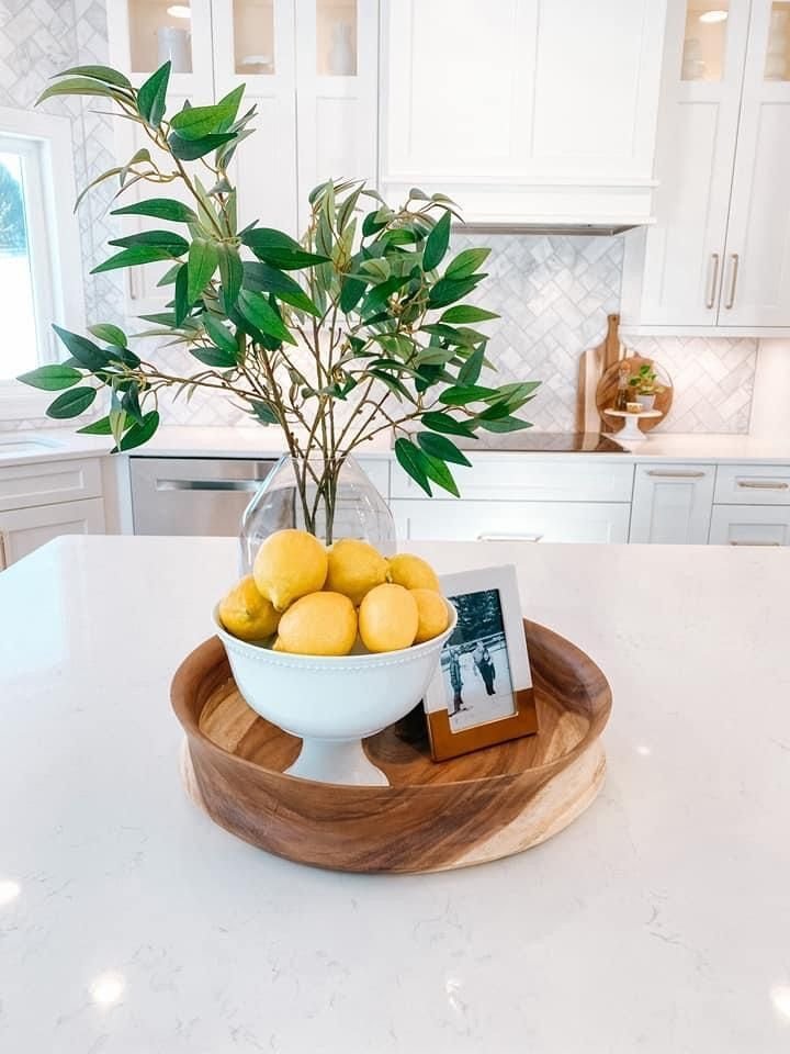 Functional fruit display styled and grouped by color on a kitchen island