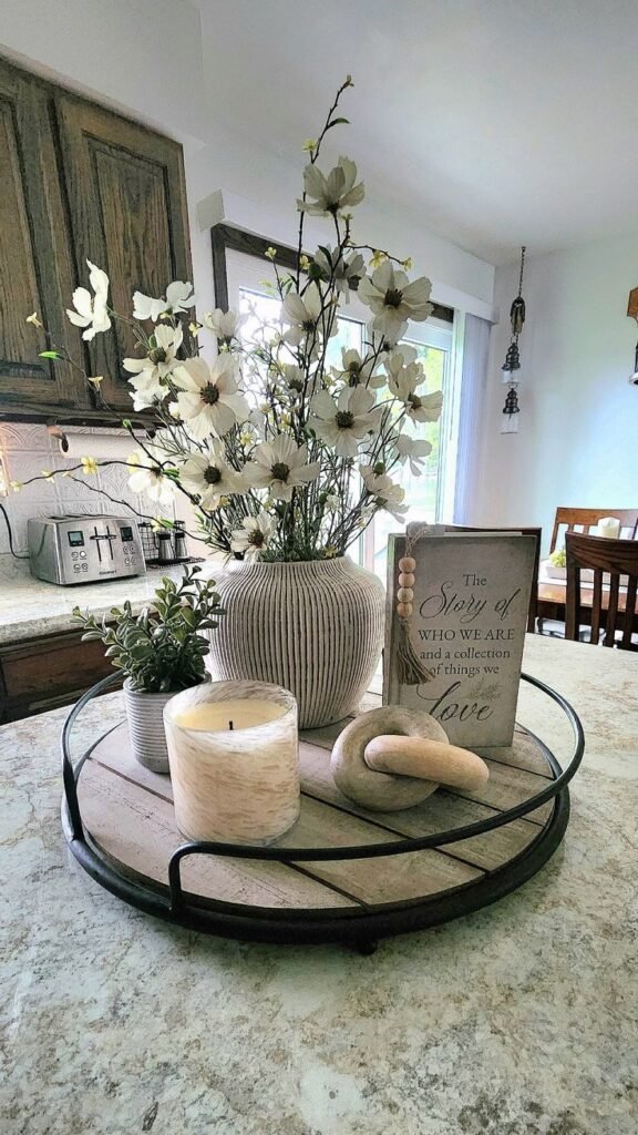 Sculptural vase styled alone as a kitchen island centerpiece