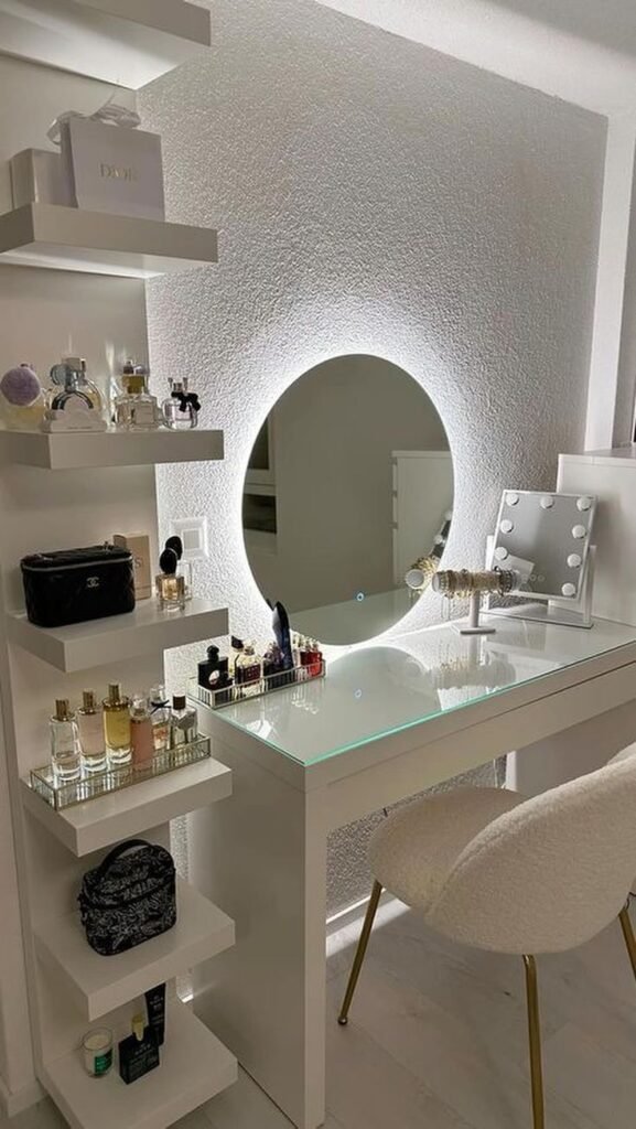 Hollywood glam makeup vanity with a large LED-lit mirror and plush stool
