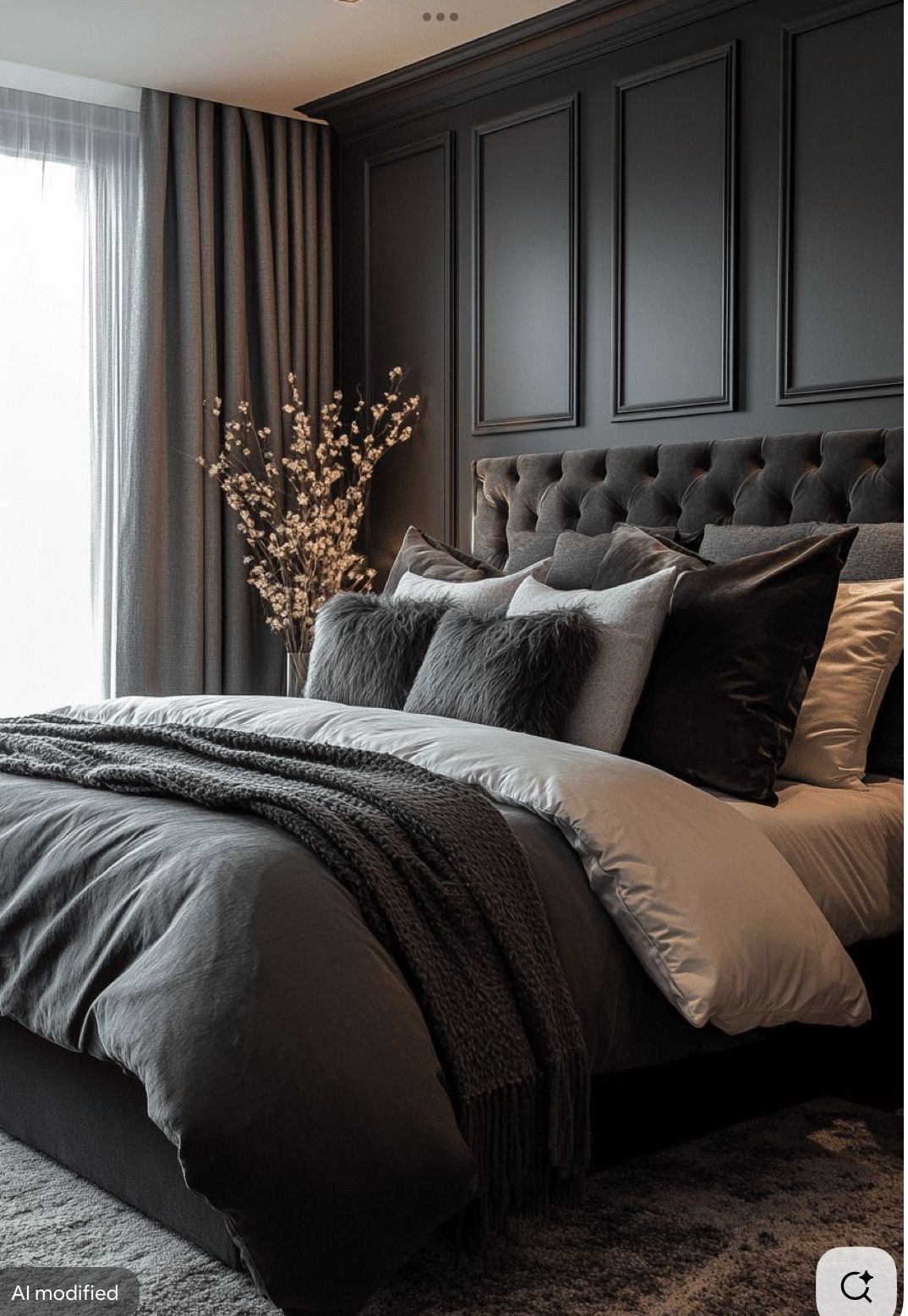 Charcoal paneled bedroom with a brown velvet tufted headboard, velvet and faux fur pillows and layered gray bedding