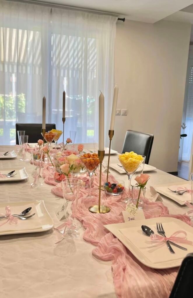 Classic layered party table setup with a tablecloth, runner and stacked trays
