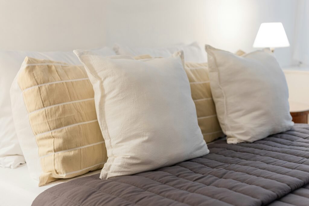 Step-by-step pillow layering technique for a polished bed look