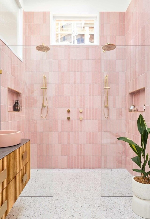 Pink tile in a bathroom paired with matte black fixtures