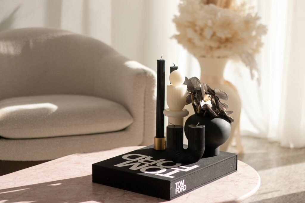 Ceramic and stone decor pieces styled on a coffee table