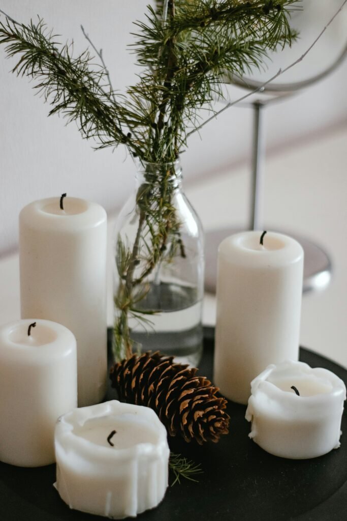 Scented candles styled for a cozy winter atmosphere