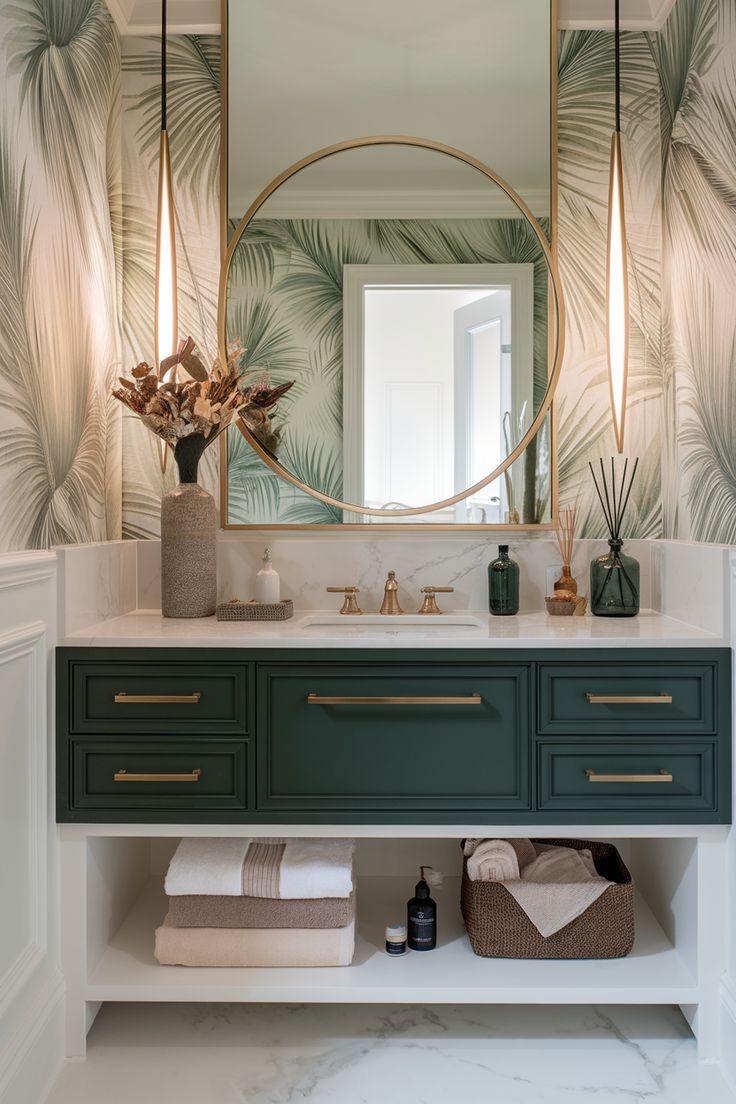 Tropical palm wallpaper powder room with a round brass mirror, wood console vanity, vessel sink and gold orb sconces
