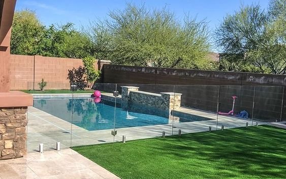 Glass fence installation around a small pool for an open sightline