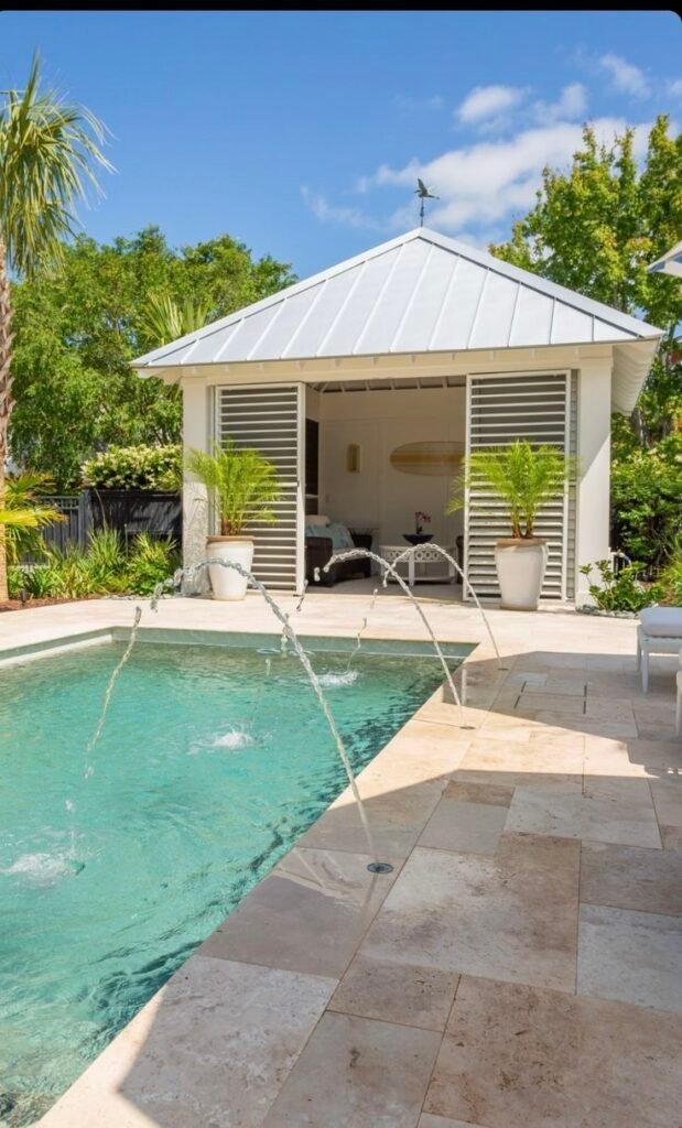 Pool paired with a slim outdoor shower for a resort feel