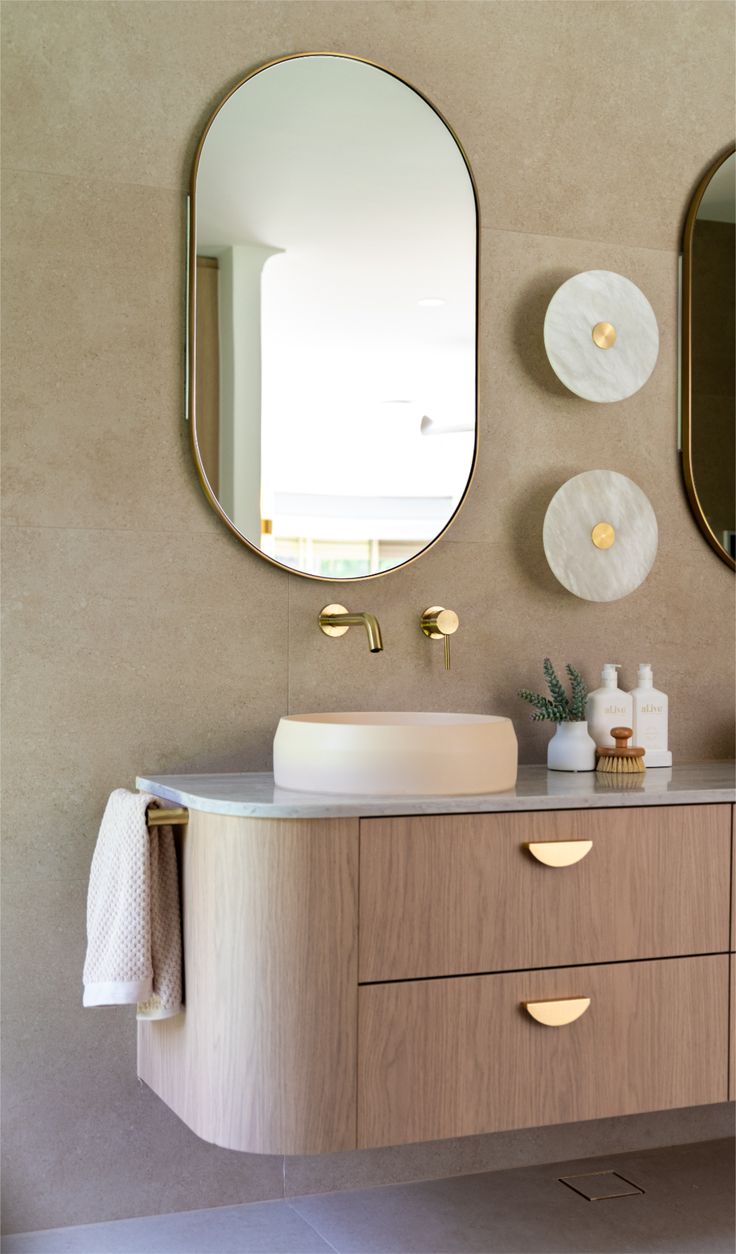 Custom floating vanity with curved timber detailing