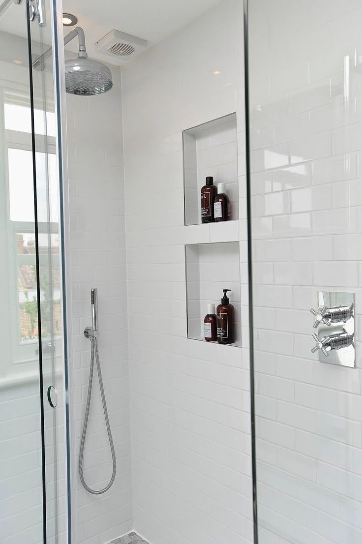 Recessed shower niche with a glass shelf