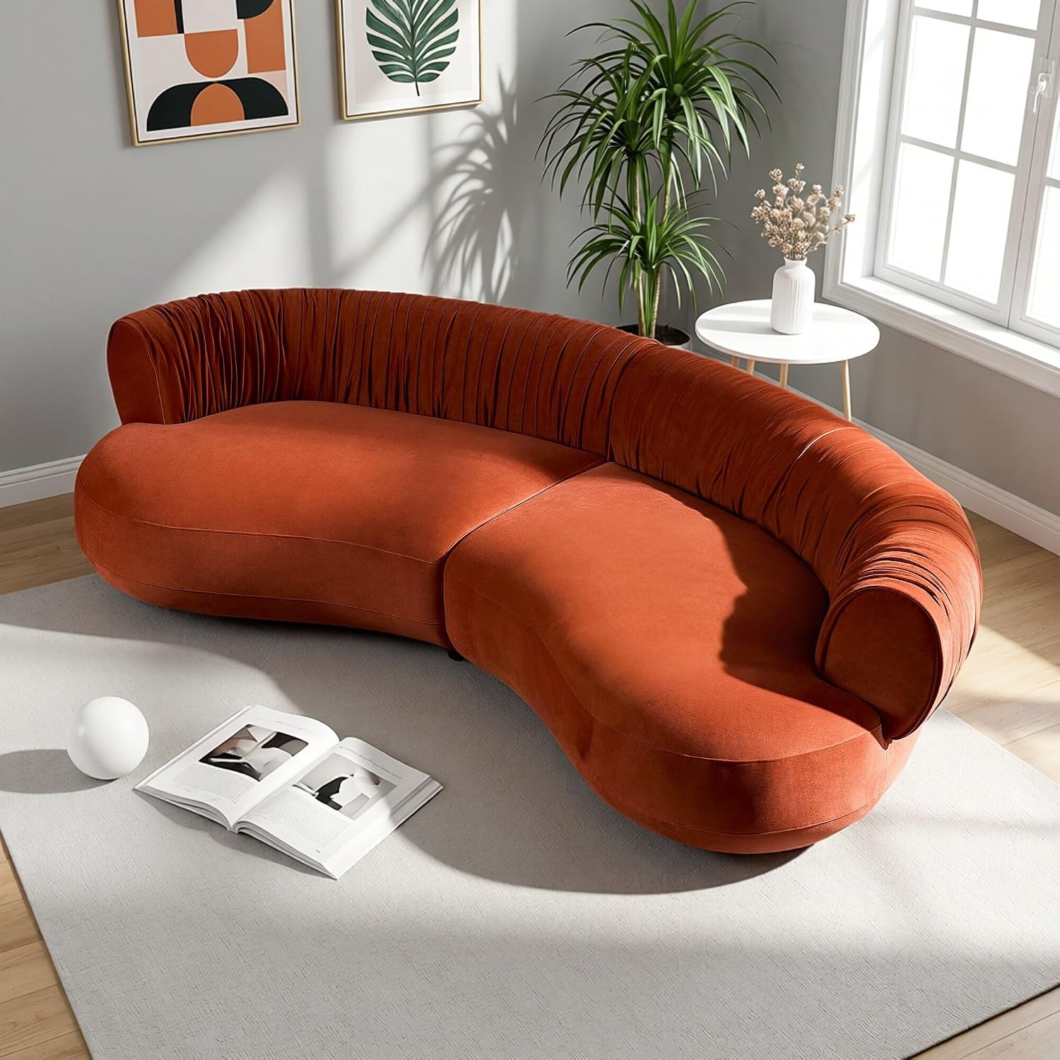Burnt orange velvet curved sofa as a bold statement piece