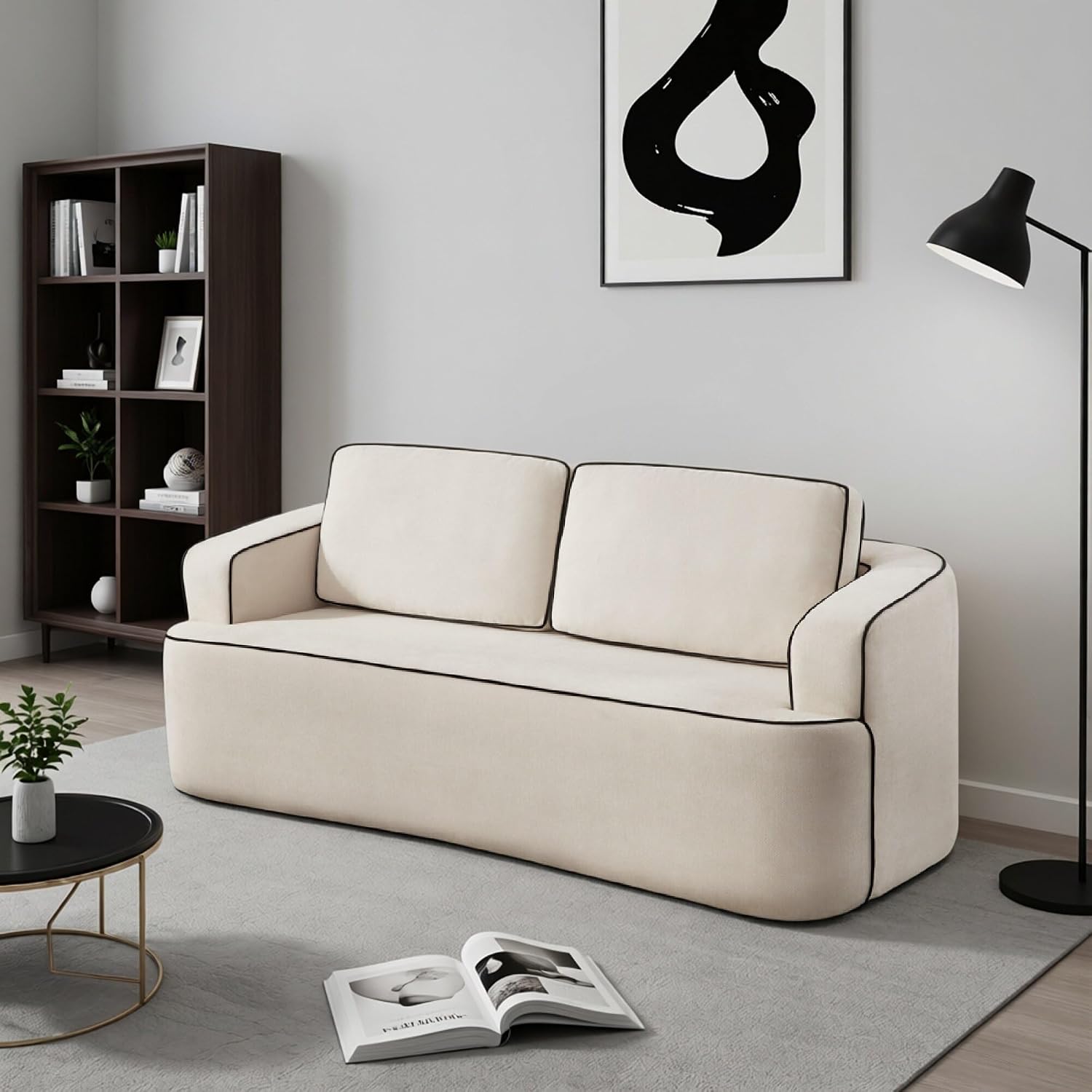 Beige linen loveseat with contrast piping in front of a bookshelf