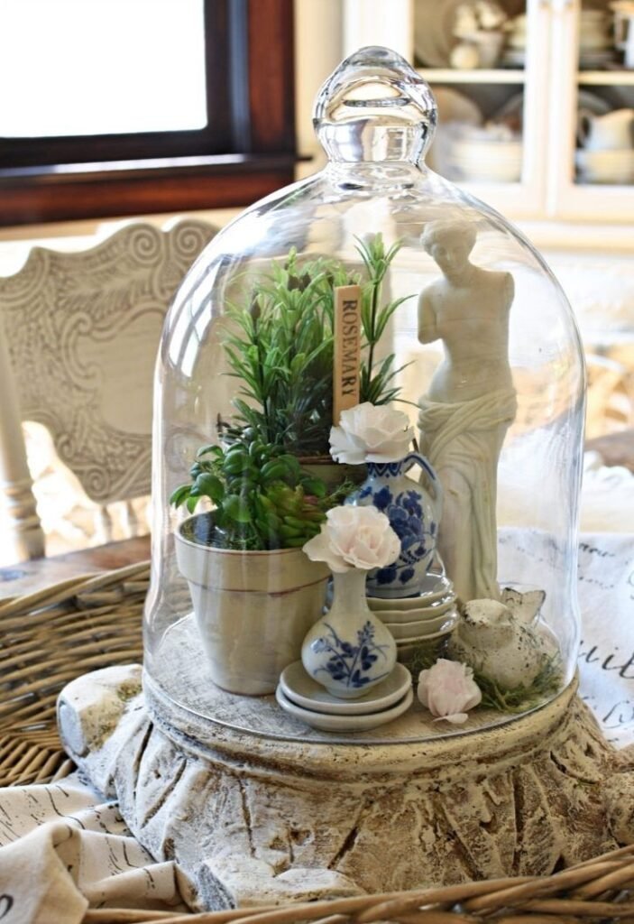 Glass cloche dome styled with moss and small spring decor