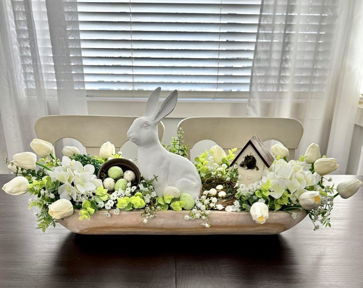 Collection of handmade spring crafts styled together, including painted jars and floral decor