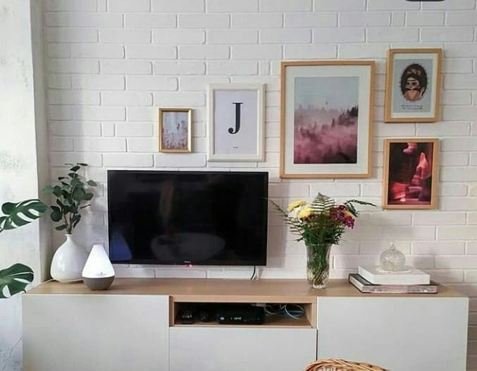 Beautifully styled TV stand with thoughtfully arranged decor