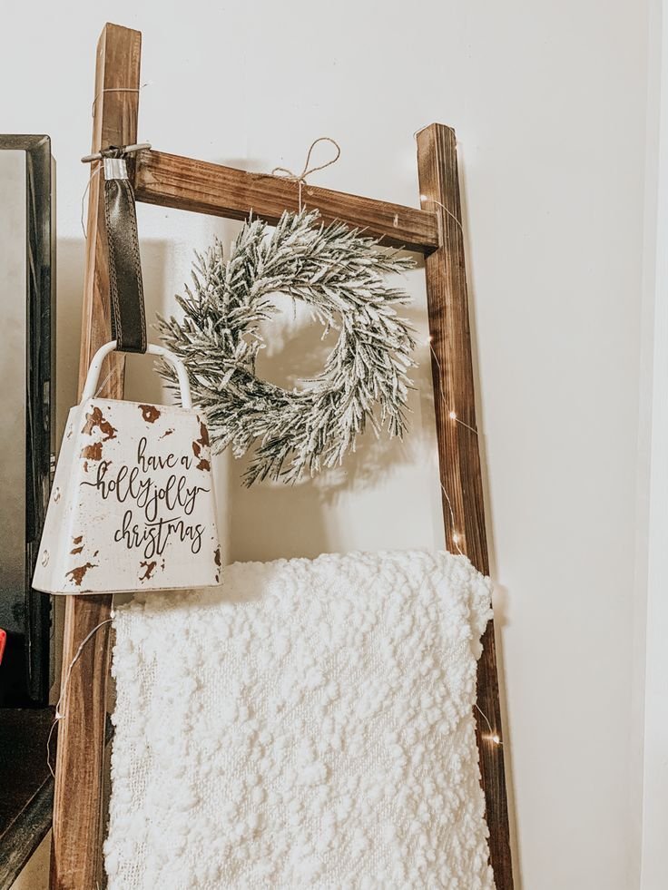 Cozy wooden blanket ladder styled with layered throws