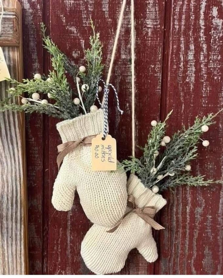 Decorated winter entryway hooks holding coats and scarves
