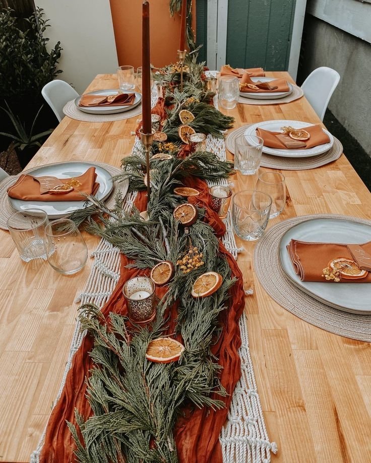 Layered neutral and textured table runners on a winter dining table