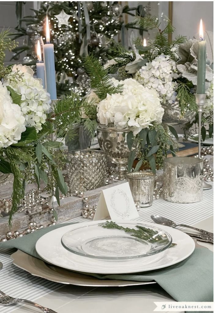 Soft neutral woven placemats framing a winter table setting
