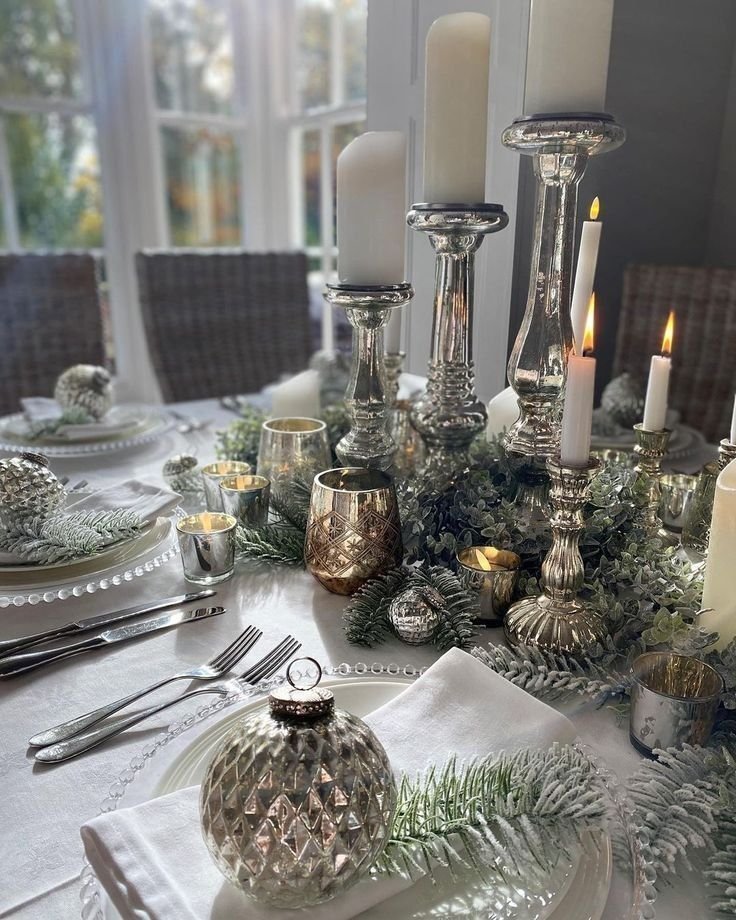 Vintage and handmade serving pieces styled on a winter dining table